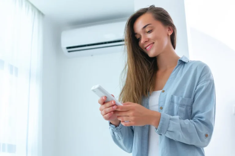 young-attractive-woman-control-air-conditioner-temperature-using-remote-controller-room-home-1-1024x683